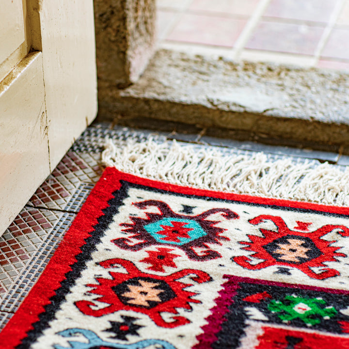 Vlněný kilim s třásněmi
