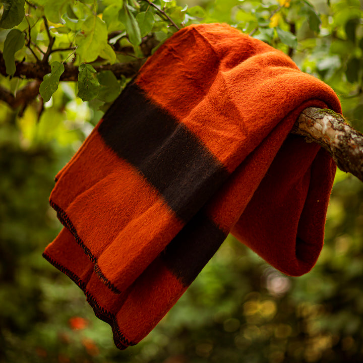 Thick wool blanket Rainbow VII in brick red with a black stripe-Balkanova