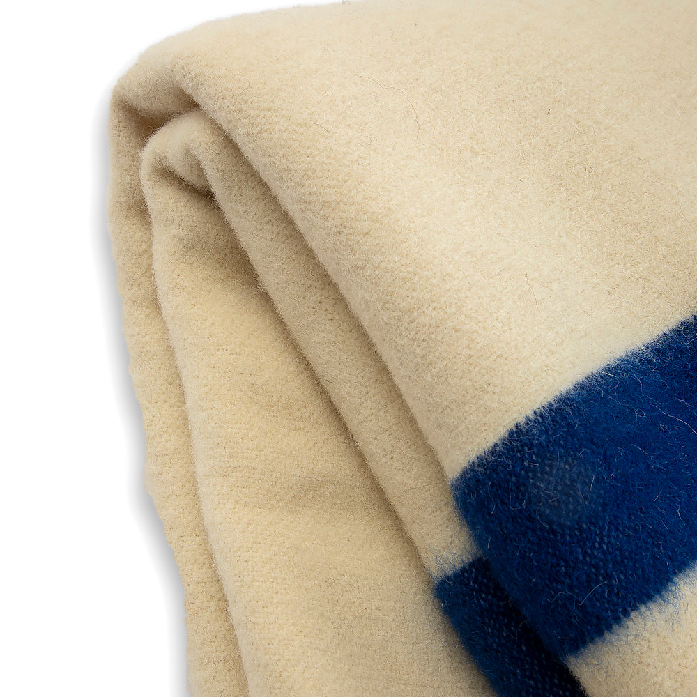 Thick wool blanket Rainbow XXIV “Rouen” – white with a blue stripe on both ends-Balkanova